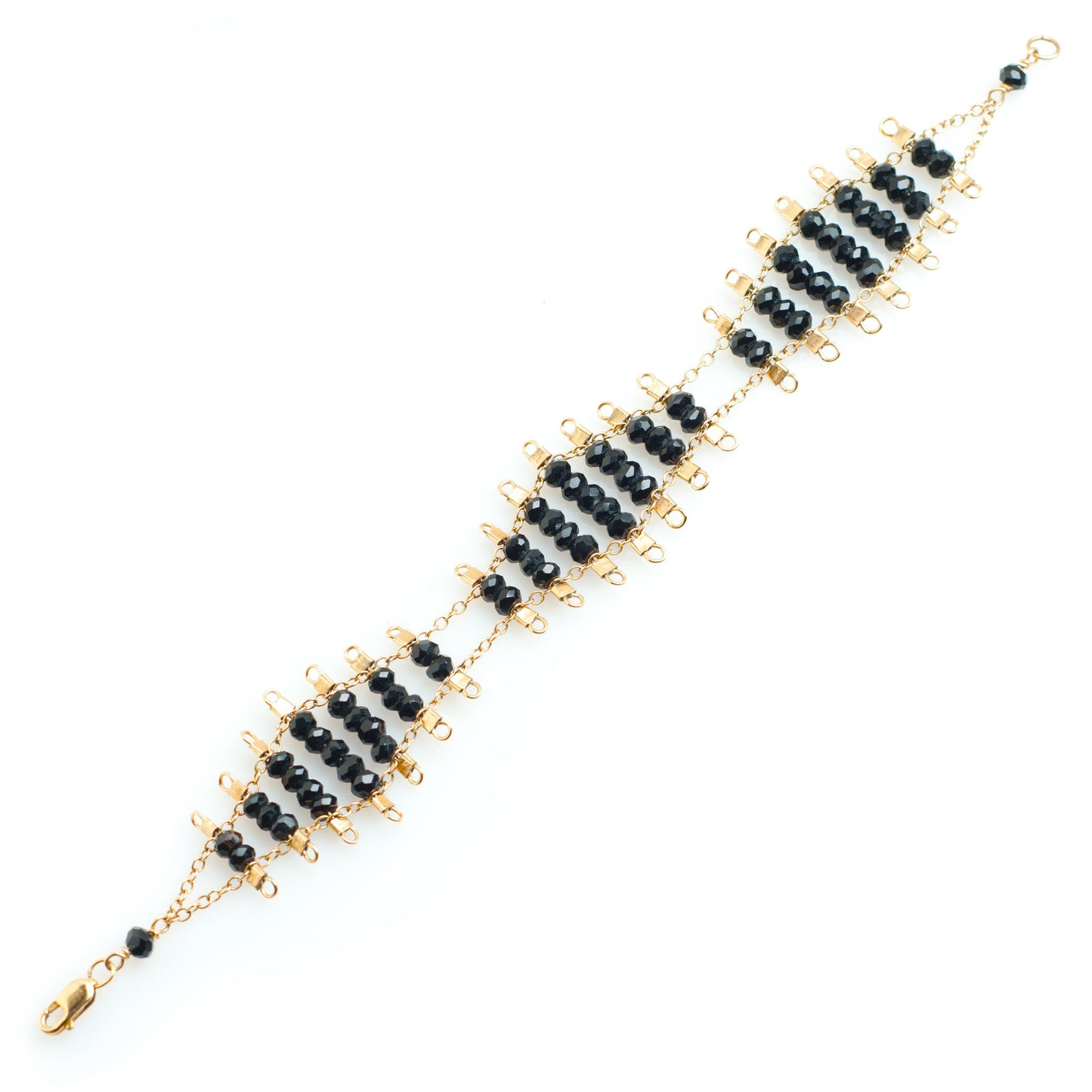 Kellan bracelet featuring rows of faceted Onyx beads, suspended on rows of 14k gold-fill wire and chain, and finished with a lobster clasp.