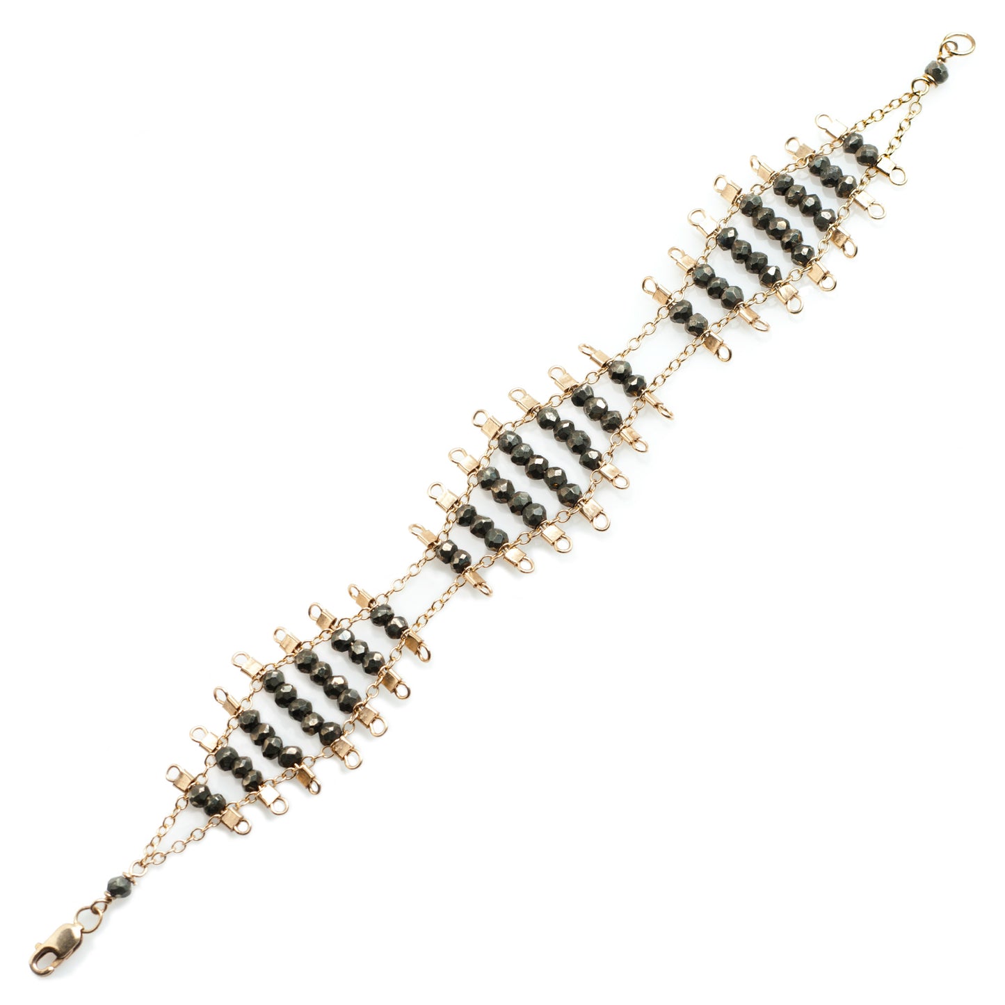 Kellan bracelet, featuring undulating rows of metallic, faceted pyrite beads, suspended on rows of 14k gold-fill wire and chain, and finished with a lobster clasp.  Approximately 7 inches in length.