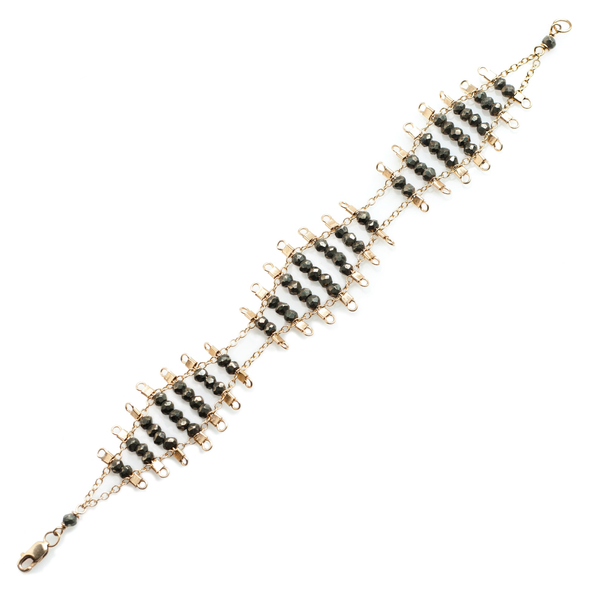 Kellan bracelet, featuring undulating rows of metallic, faceted pyrite beads, suspended on rows of 14k gold-fill wire and chain, and finished with a lobster clasp.  Approximately 7 inches in length.