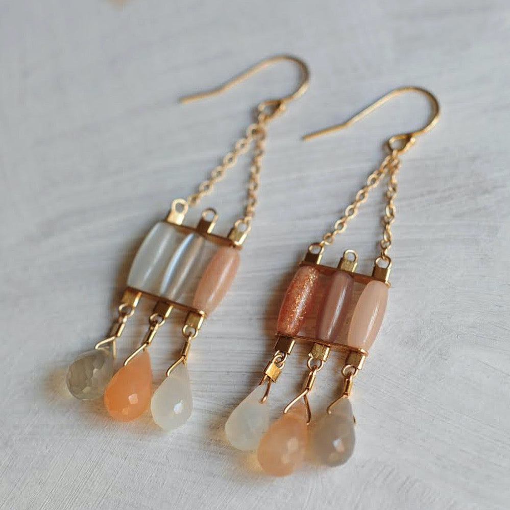 Byzantine style gold chandelier earrings with moonstones in milky white, peach, and smoke.